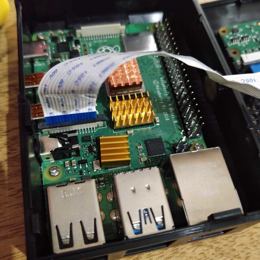 A photo of a Raspberry Pi and a Camera Ribbon connected